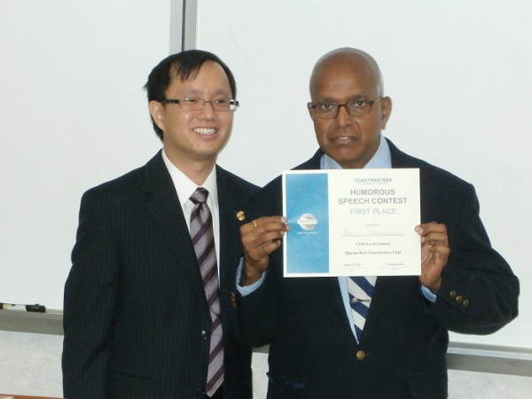 Raja Ramaswamy is the winner for Humorous Speech Contes, here with The Presinding Officer & Chief Judge